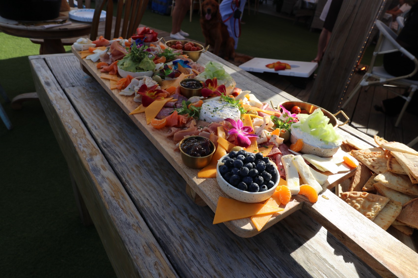 A long table of charcuterie boards laid out for an event